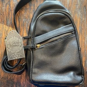 Women's small crossbody black sling bag. Faux black leather.